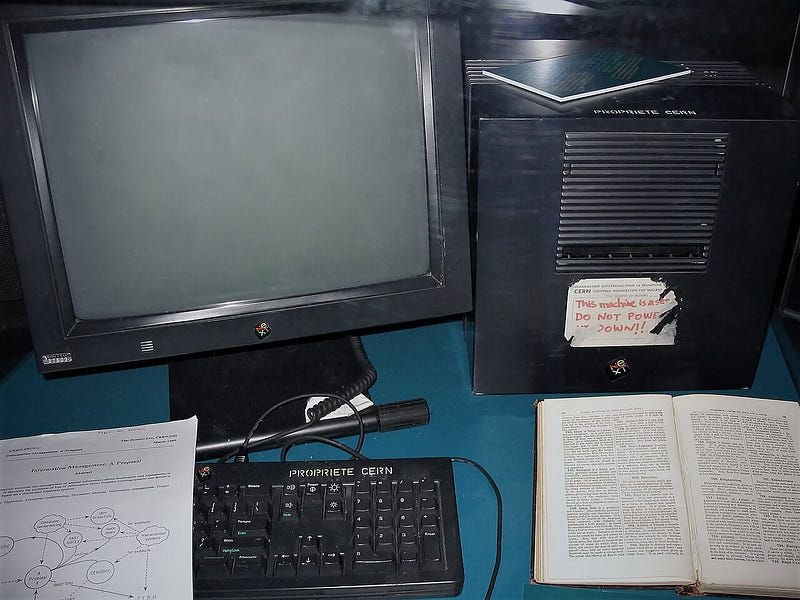 CERN's NeXTcube — the world's first web server, with its handwritten sign "This machine is a server. DO NOT POWER IT DOWN!!". Photo by Coolcaesar, CC BY-SA 3.0, via Wikimedia Commons.