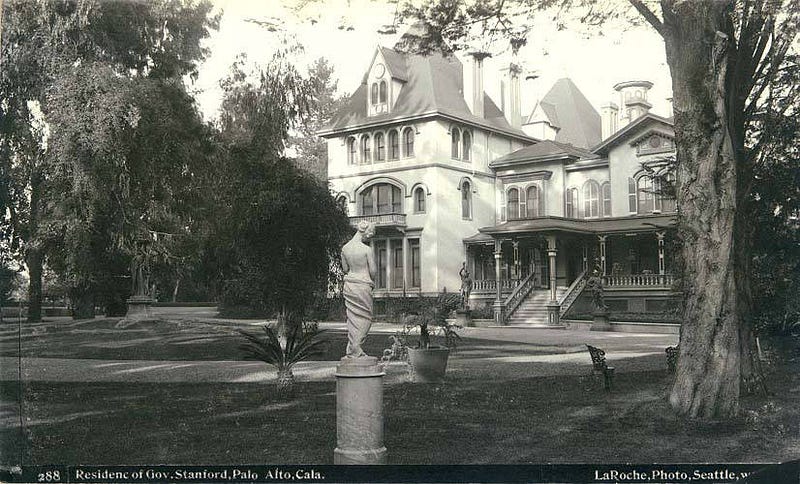 The Stanford family residence on the Palo Alto Stock Farm, ca. 1888 — the 8,180-acre horse-breeding estate that would become the Stanford University campus. Frank La Roche, Public domain, via Wikimedia Commons.