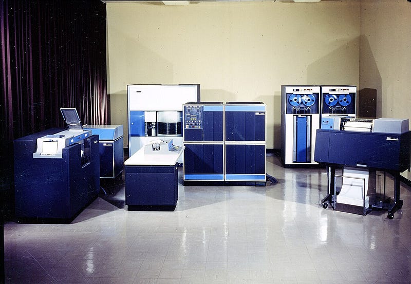 IBM 1401 Data Processing System. From the left: 1402 Card Read-Punch, 1406 Storage Unit, 1405 RAMAC Disk Unit, 1407 Console Inquiry Station, 1401 Processing Unit, two 729 Magnetic Tape Units, 1403 Printer. (courtesy of IBM Archives)
