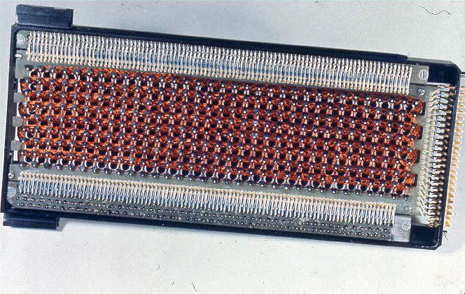 Core rope memory: copper wires woven through a grid of tiny magnetic ferrite cores, the physical storage medium for Apollo's flight software /https://commons.wikimedia.org/wiki/Special:FilePath/Agc_rope.jpg